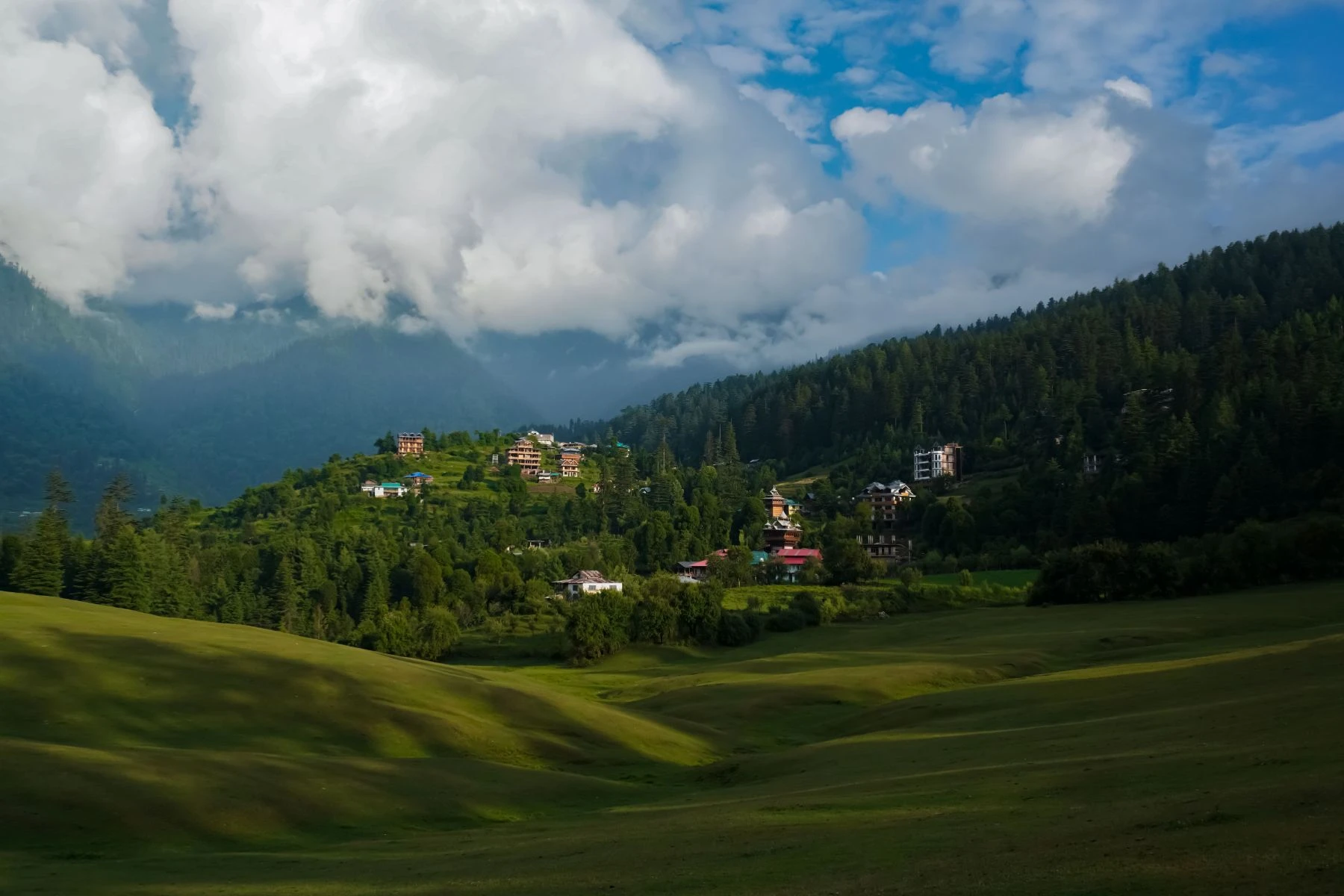 Scenic Khajjiar valley surrounded by mountains near Dalhousie, Himachal Pradesh